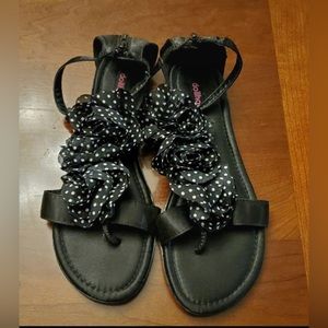 Dollhouse ladies sandals are a size 9.